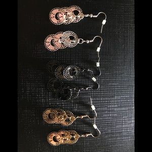 Black, silver, and gold earrings